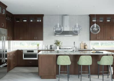 Dark brown kitchen cabinets with light marble countertops, and island and green stools